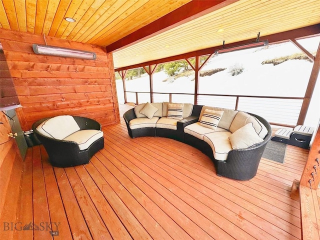 wooden deck with an outdoor living space