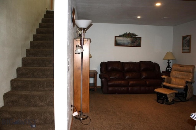 carpeted living room featuring stairway and recessed lighting