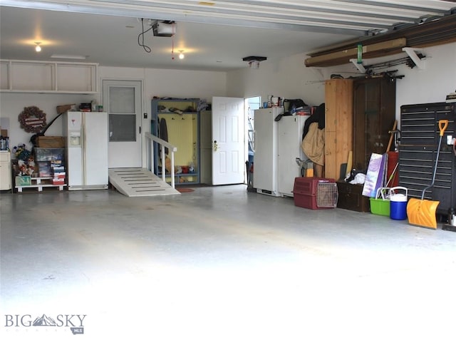 garage featuring a garage door opener and white fridge with ice dispenser