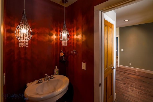 284 Annie Glade, Bozeman, MT 59718 - bathroom with baseboards, wood finished floors, a sink, and recessed lighting