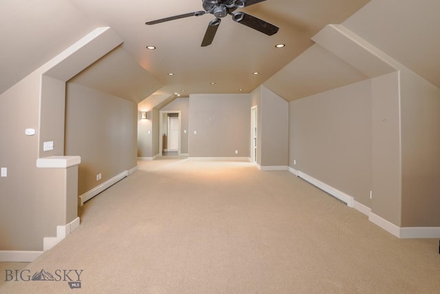 284 Annie Glade, Bozeman, MT 59718 - additional living space with baseboard heating, light colored carpet, ceiling fan, lofted ceiling, and recessed lighting