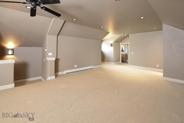284 Annie Glade, Bozeman, MT 59718 - additional living space with a baseboard radiator, vaulted ceiling, a ceiling fan, light colored carpet, and recessed lighting