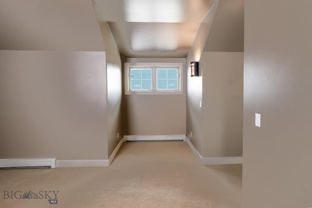 284 Annie Glade, Bozeman, MT 59718 - empty room with light colored carpet, baseboards, a baseboard radiator, and baseboard heating