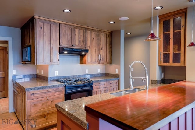 284 Annie Glade, Bozeman, MT 59718 - kitchen featuring under cabinet range hood, black appliances, a sink, a peninsula, and recessed lighting