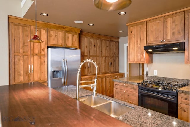 284 Annie Glade, Bozeman, MT 59718 - kitchen featuring black gas stove, under cabinet range hood, stainless steel fridge, a sink, and recessed lighting