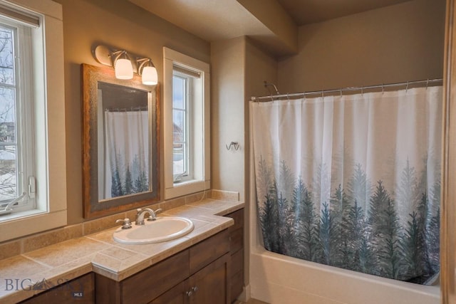 284 Annie Glade, Bozeman, MT 59718 - bathroom featuring vanity, healthy amount of natural light, and shower / bath combo with shower curtain