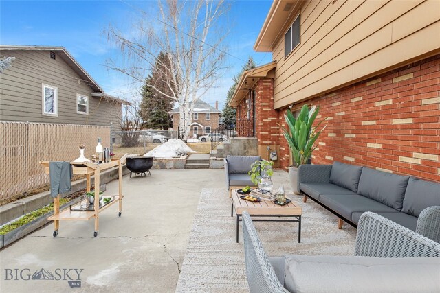view of patio / terrace featuring an outdoor hangout area and fence