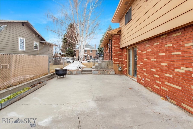 view of patio featuring fence