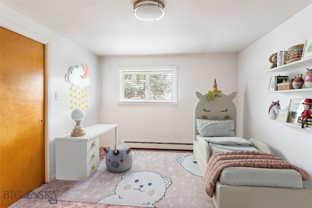 living area with a baseboard heating unit and carpet flooring