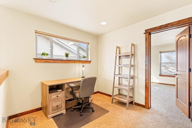 carpeted office space featuring recessed lighting and baseboards