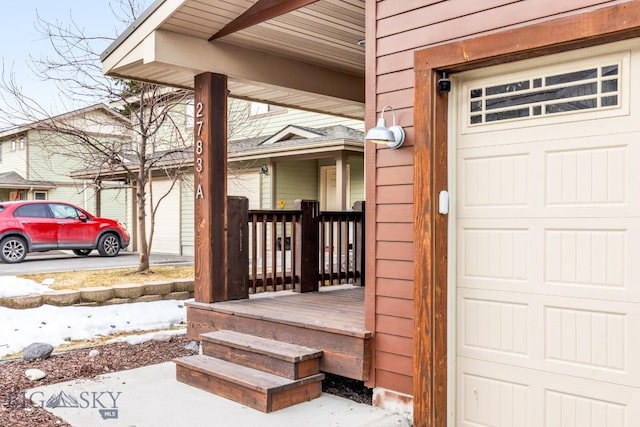 view of exterior entry with a porch