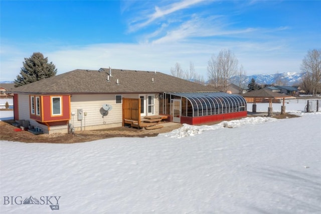 view of front of property with a sunroom