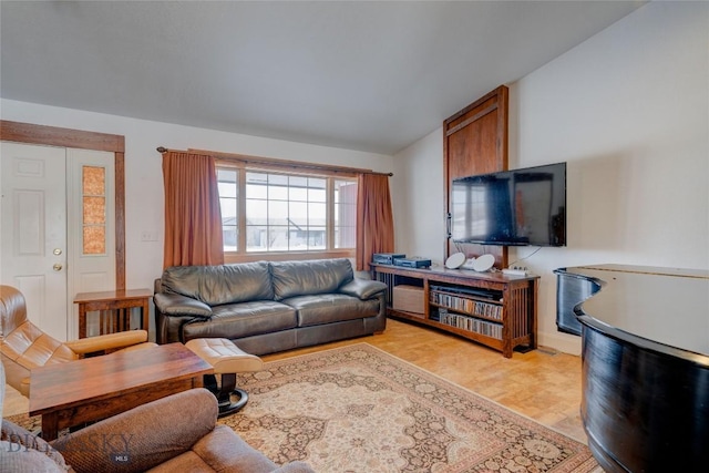 living area featuring lofted ceiling and light wood-style flooring