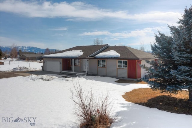 single story home featuring a garage