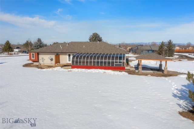 view of front of property featuring a gazebo and a sunroom