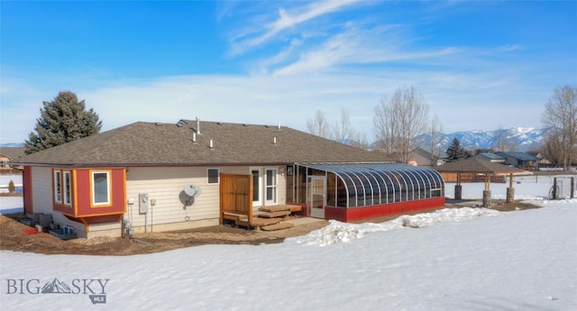 view of front of property with a sunroom