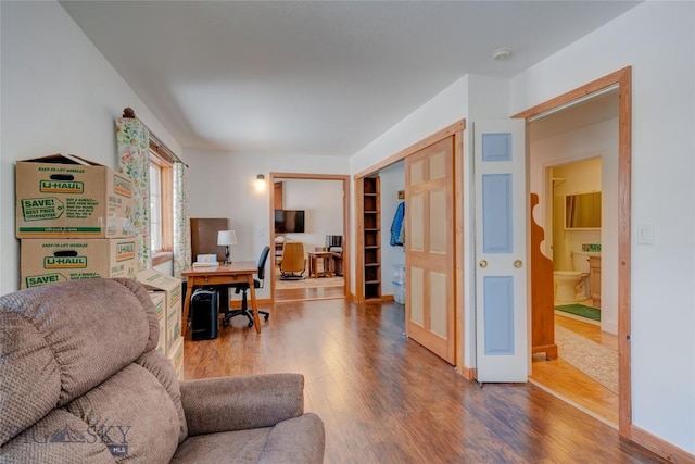 office area featuring wood finished floors and baseboards