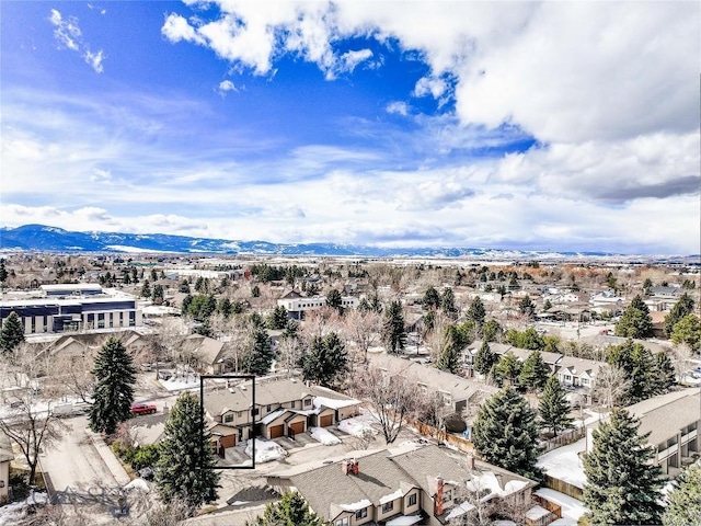 birds eye view of property with a mountain view and a residential view