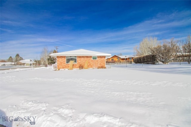 view of snow covered property