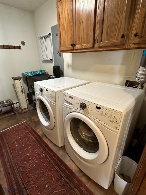 laundry area with cabinet space and separate washer and dryer