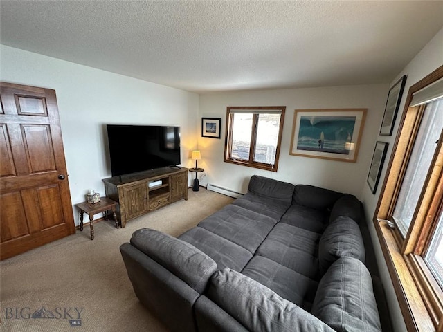 living room with a textured ceiling, baseboard heating, and light carpet