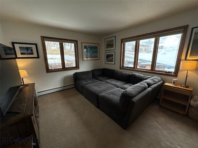 living room with a baseboard heating unit, carpet flooring, and a textured ceiling