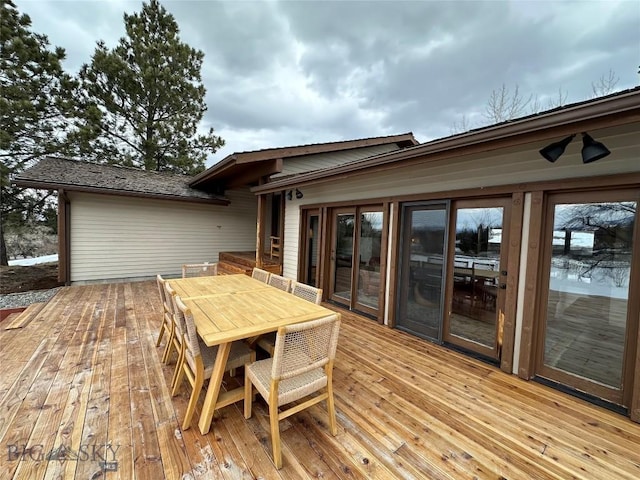 wooden deck with outdoor dining space