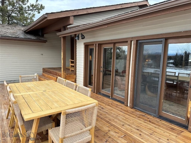 deck featuring outdoor dining area