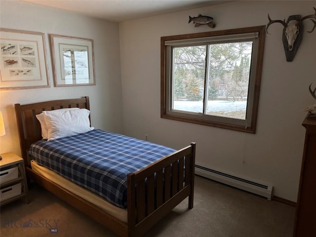 carpeted bedroom featuring baseboard heating