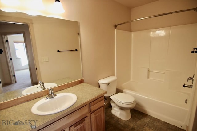 bathroom with toilet, vanity, and bathing tub / shower combination