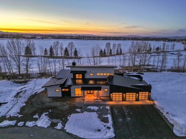 view of front of property with metal roof and a standing seam roof