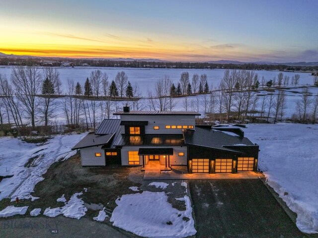 view of front of home featuring metal roof and a standing seam roof