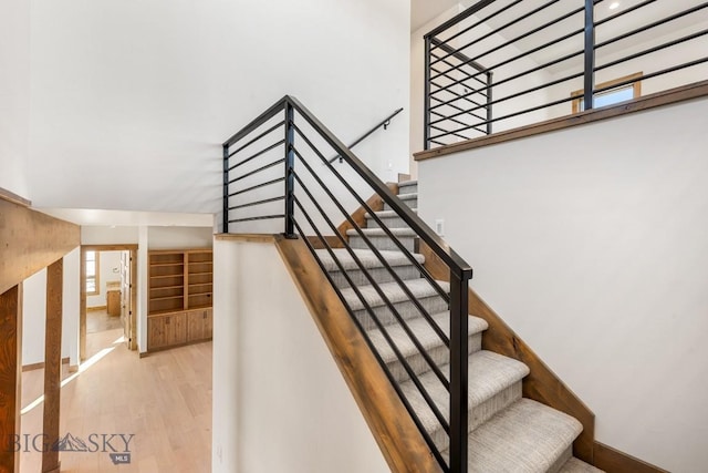 stairs with wood finished floors