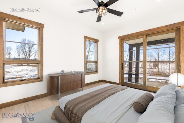 bedroom featuring access to exterior, light wood-style floors, baseboards, and ceiling fan