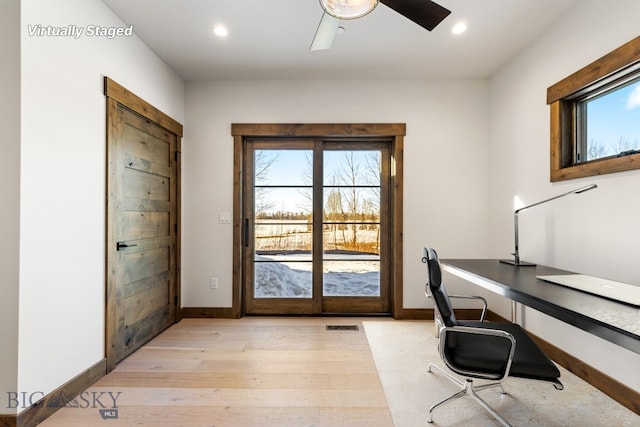 unfurnished office featuring recessed lighting, baseboards, a ceiling fan, and light wood finished floors