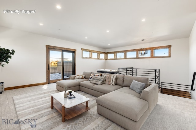 living area with recessed lighting, baseboards, and light colored carpet