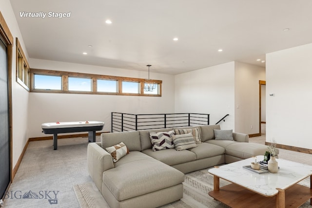 living area with recessed lighting, baseboards, and light colored carpet