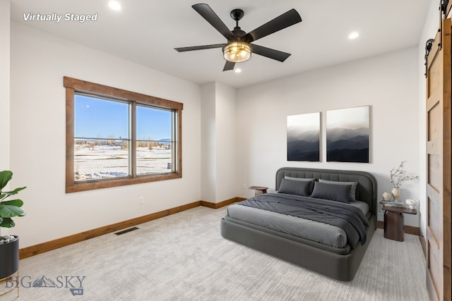 33 Leachman Ln, Bozeman, MT 59718 - carpeted bedroom featuring baseboards, a barn door, recessed lighting, and a ceiling fan