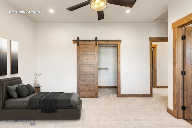 carpeted bedroom featuring recessed lighting, baseboards, a barn door, and a ceiling fan