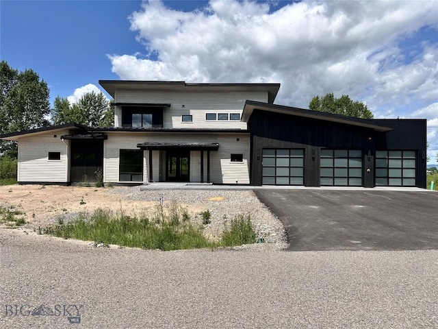 33 Leachman Ln, Bozeman, MT 59718 - contemporary house with a garage and asphalt driveway
