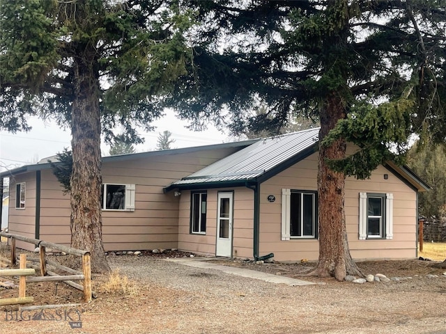 129 E Steffens St, Ennis, MT 59729 - ranch-style home with driveway and metal roof