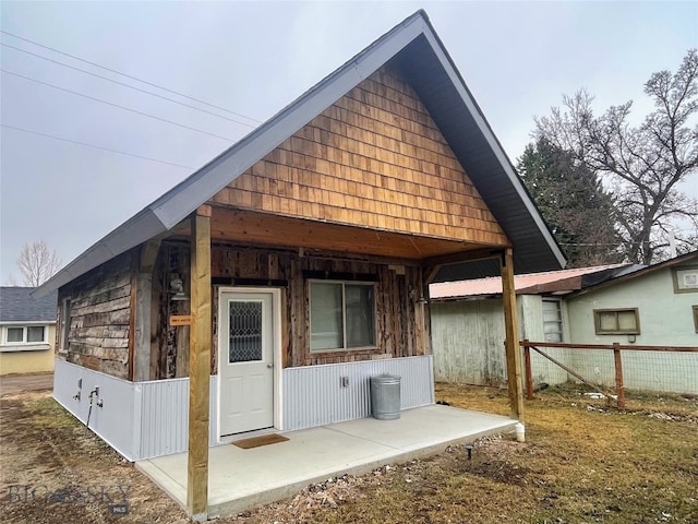 back of property with fence