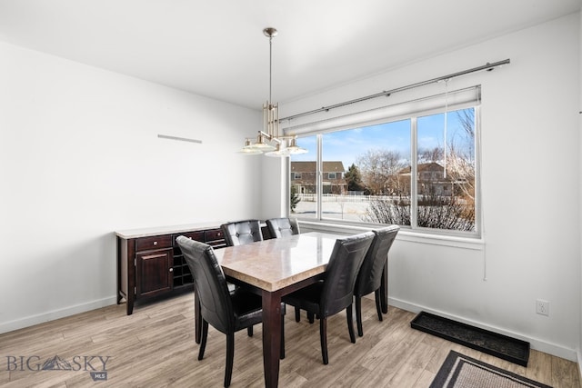 2465 Lasso Ave, Bozeman, MT 59718 - dining room featuring light wood finished floors and a chandelier