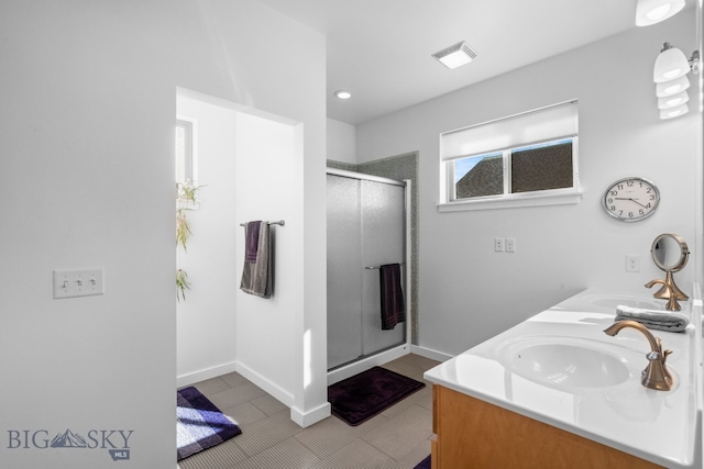 2465 Lasso Ave, Bozeman, MT 59718 - bathroom featuring a stall shower, double vanity, tile patterned flooring, and recessed lighting
