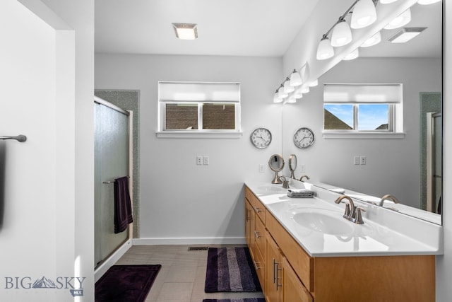 2465 Lasso Ave, Bozeman, MT 59718 - full bath featuring double vanity, a stall shower, and tile patterned floors