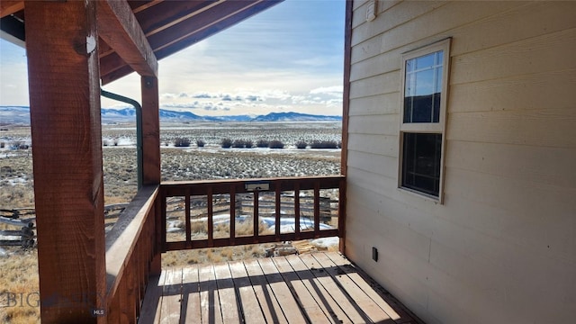 wooden terrace with a mountain view