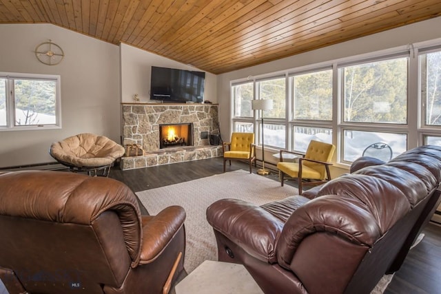 living area with a stone fireplace, wood ceiling, wood finished floors, and vaulted ceiling