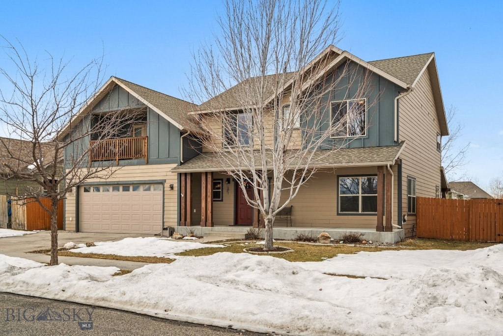 1035 Springbrook Ave, Bozeman, MT 59718 - view of front of property with fence, driveway, a porch, an attached garage, and a shingled roof