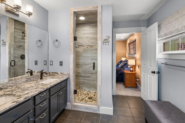 2236 Gallatin Green Blvd Unit C, Bozeman, MT 59718 - ensuite bathroom with a stall shower, tile patterned flooring, double vanity, and baseboards