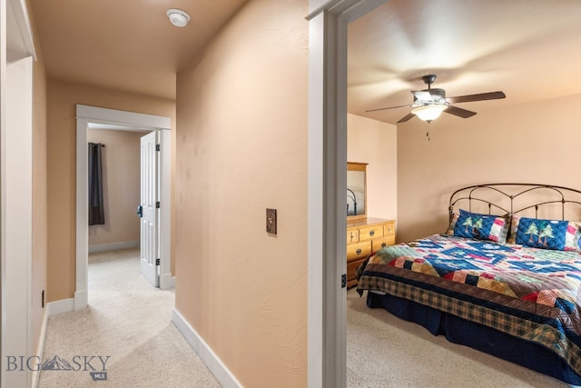 2236 Gallatin Green Blvd Unit C, Bozeman, MT 59718 - bedroom featuring light colored carpet, ceiling fan, and baseboards
